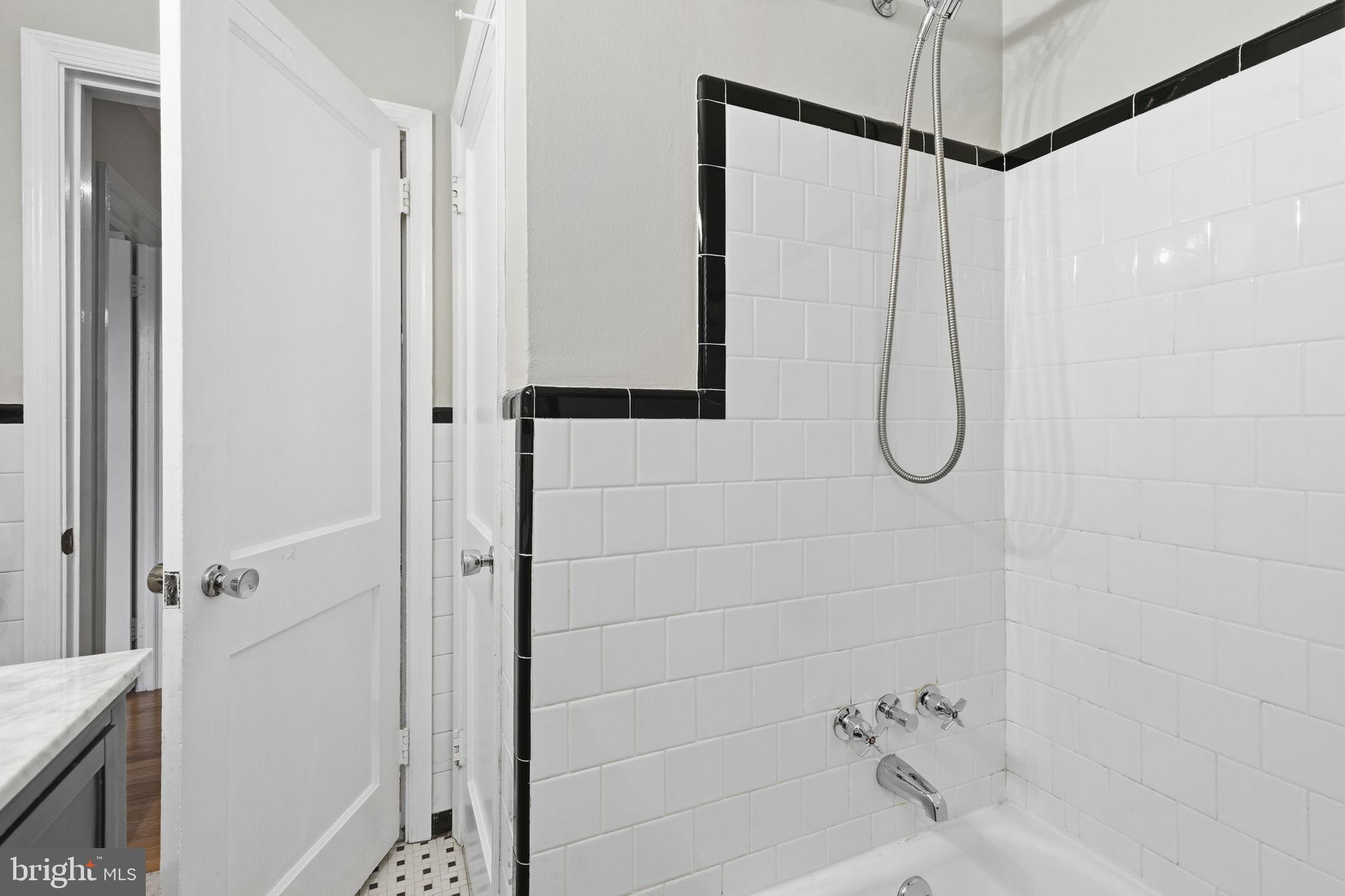 1587 Doxbury Road Towson, MD 21286 - Photo 18 of 31 Sleek bathroom with classic tile design.