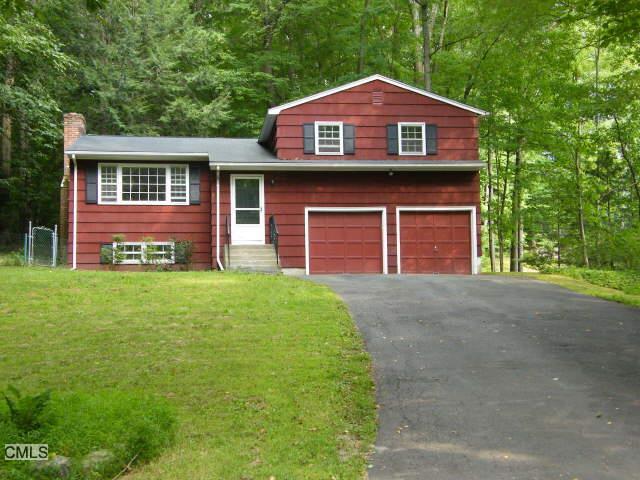 29 Shields Lane Ridgefield, CT 06877 - Photo 1 of 1 a front view of a house with garden