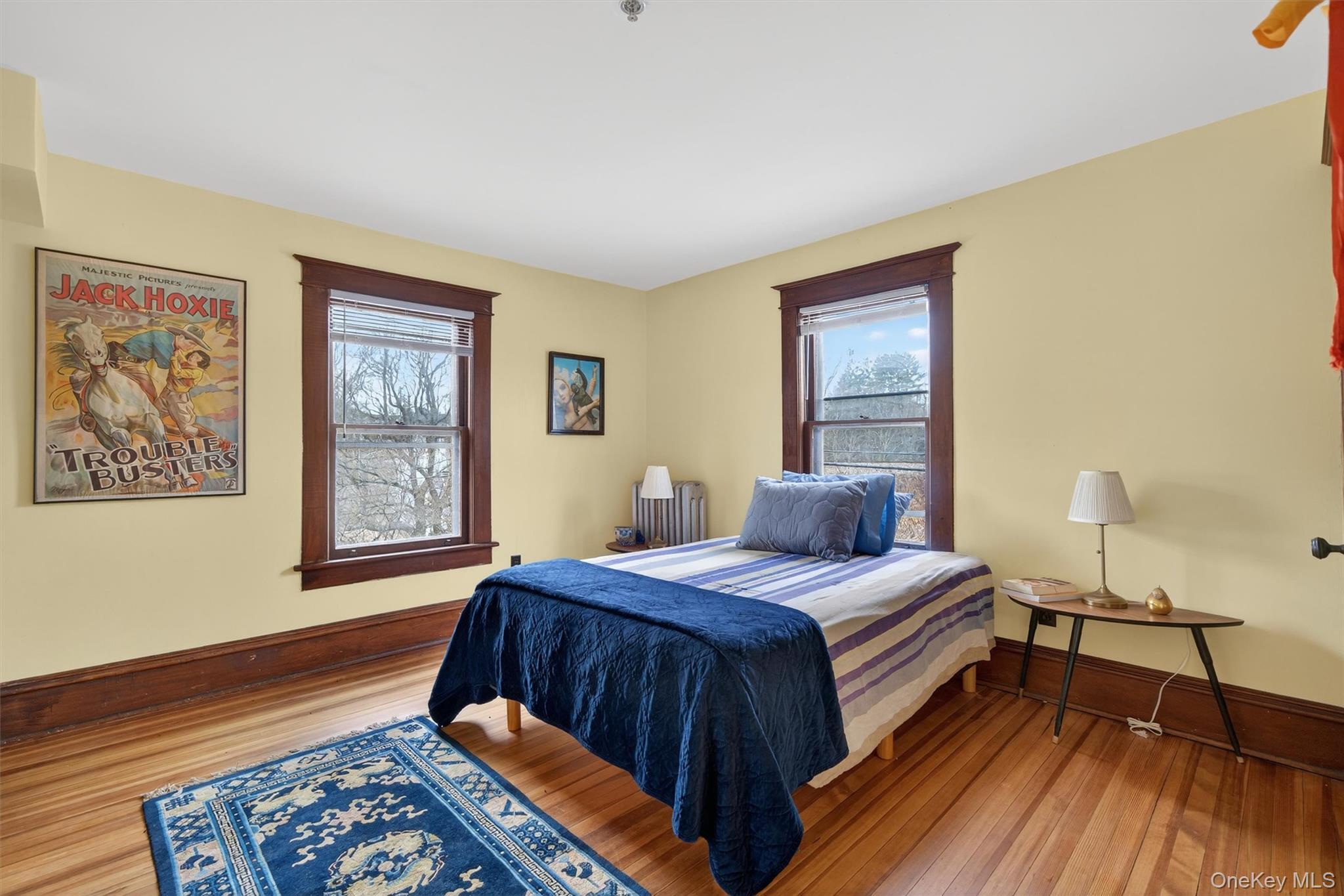 48 Kirks Road Narrowsburg, NY 12764 - Photo 23 of 50 a bedroom with a bed and wooden floor