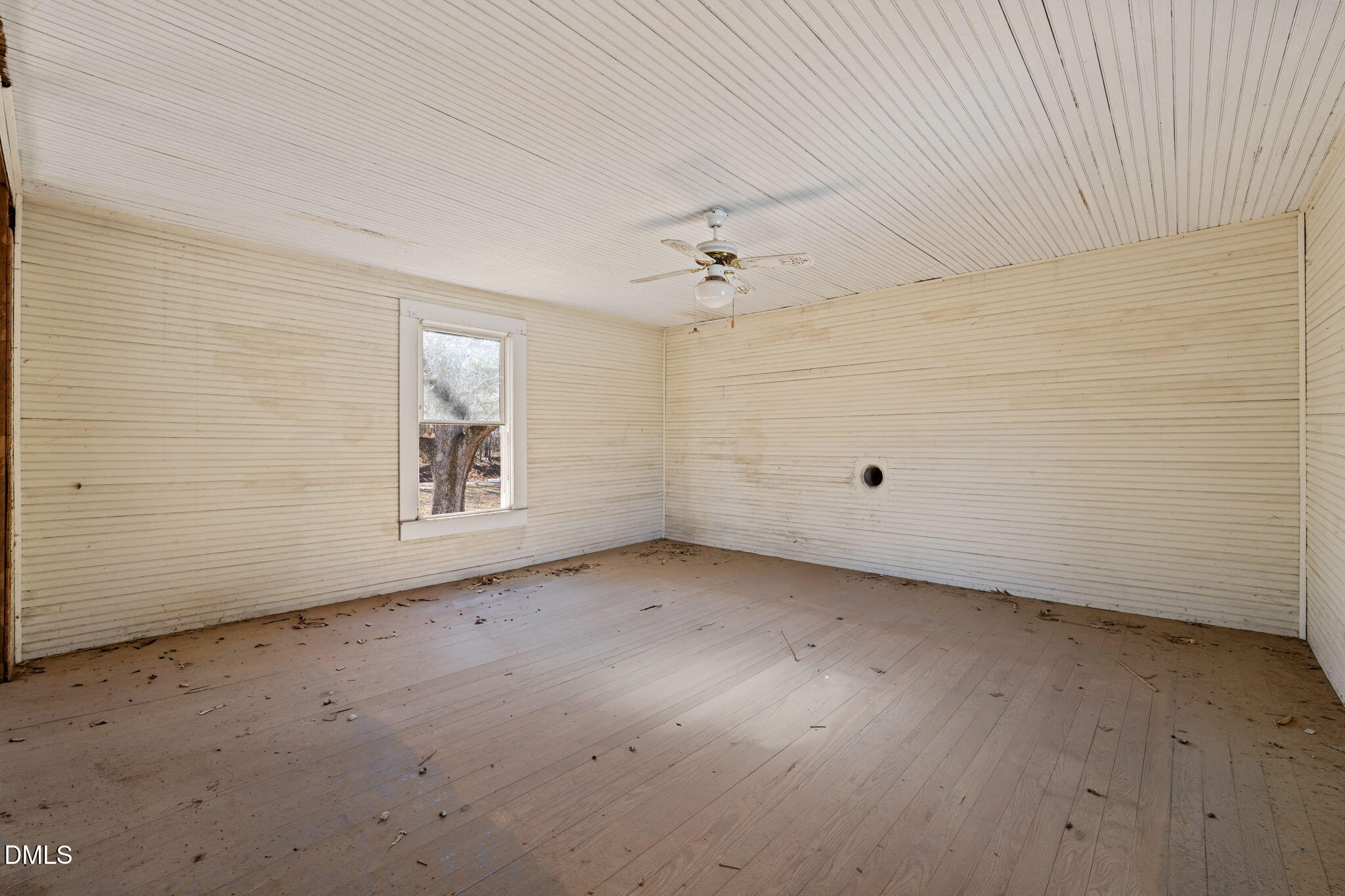 2822 Little River Church Road Hurdle Mills, NC 27541 - Photo 15 of 26 an empty room with a empty space and windows
