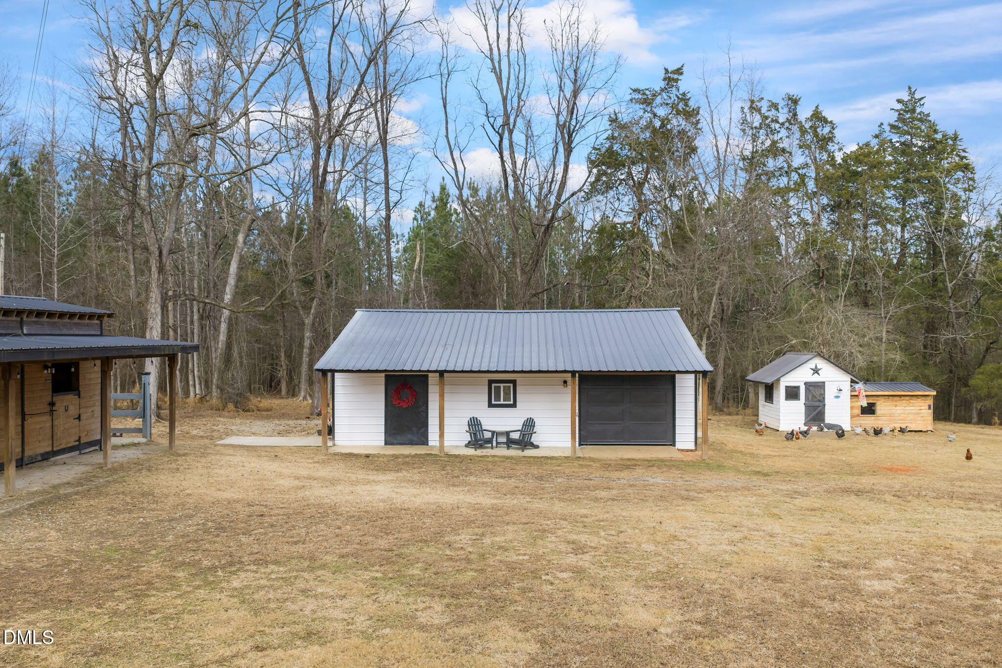 2822 Little River Church Road Hurdle Mills, NC 27541 - Photo 22 of 26 a house with trees in front of it