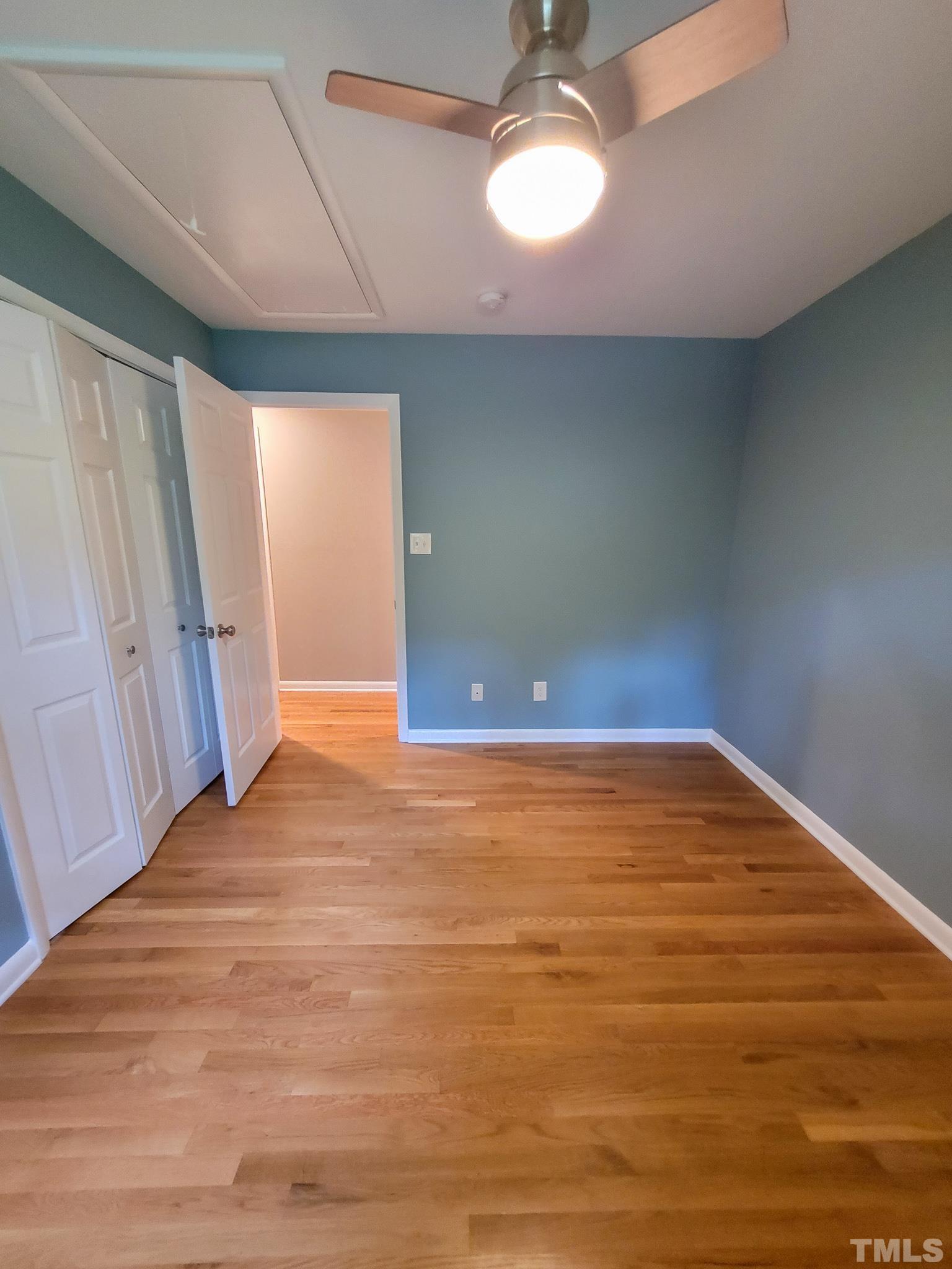 6708 Johnsdale Road Raleigh, NC 27615 - Photo 23 of 44 a view of empty room with wooden floor