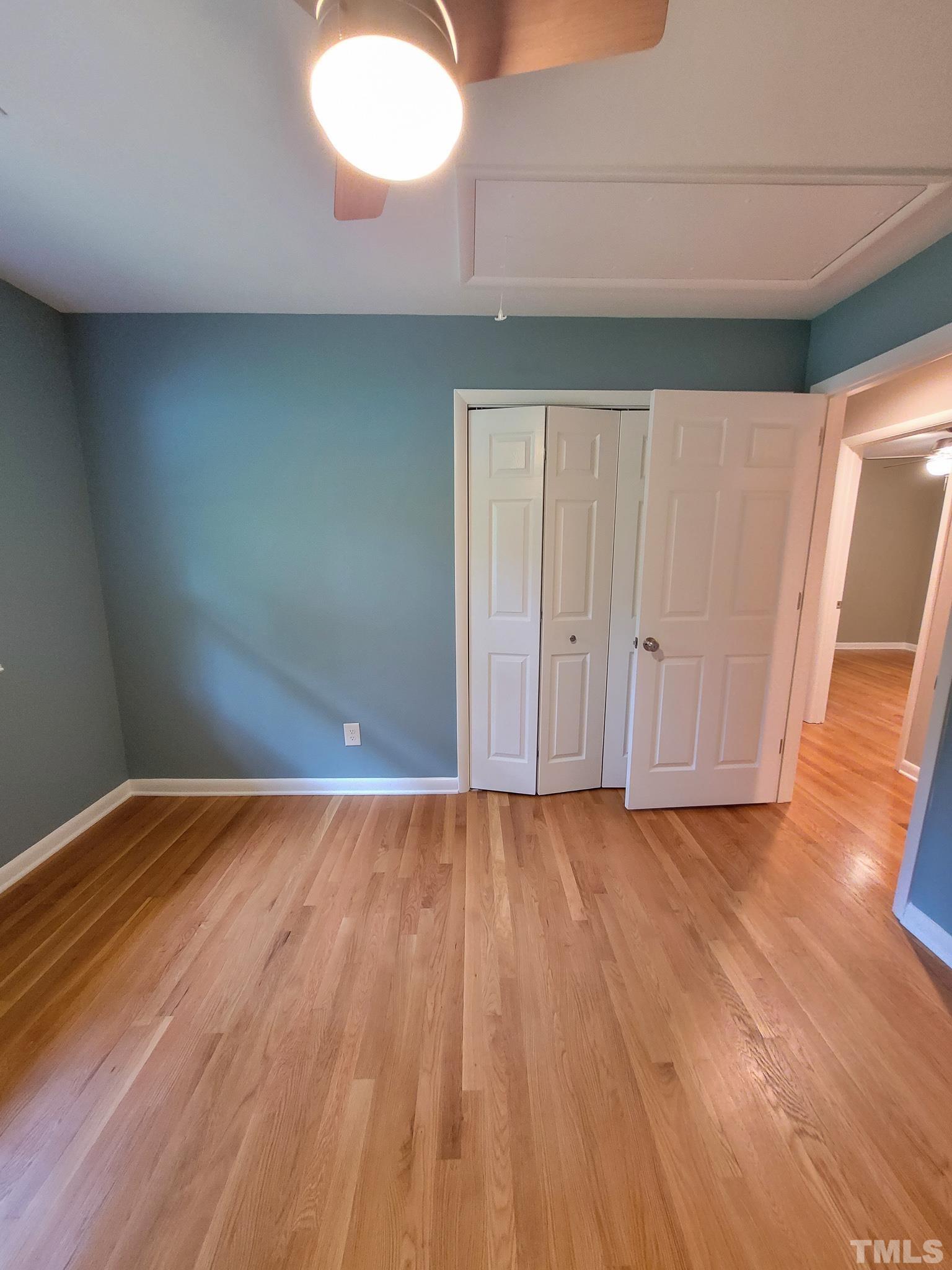 6708 Johnsdale Road Raleigh, NC 27615 - Photo 24 of 44 a view of an empty room and wooden floor