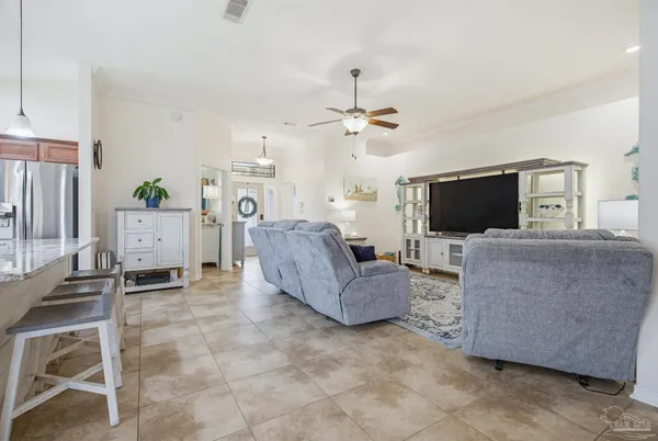 a kitchen with kitchen island granite countertop wooden floors and center island