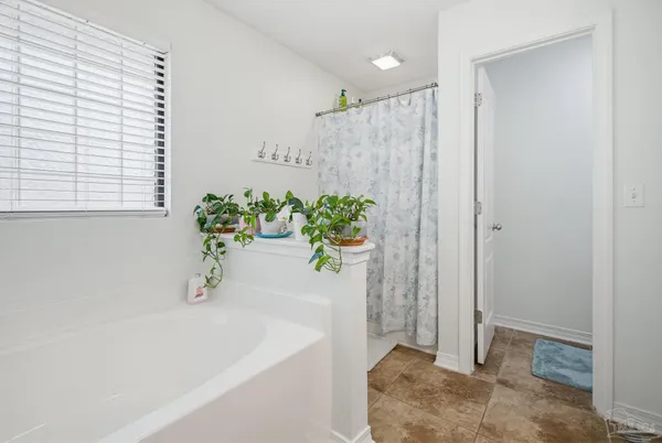 a en suite bathroom with a double vanity sink and a mirror