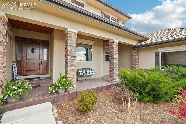 13665 Random Ridge View Colorado Springs, CO 80921 - Photo 3 of 49 Entrance to property featuring a porch
