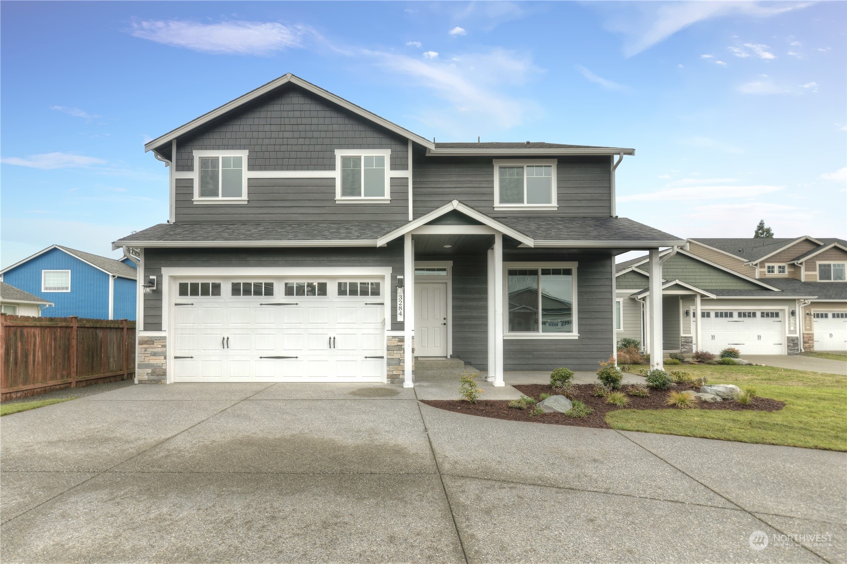 3284 Prill Road Centralia, WA 98531 - Photo 1 of 18 a front view of a house with a yard and garage