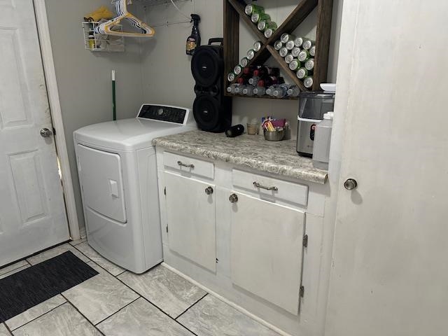 40 Lewter Road Crump, TN 38327 - Photo 17 of 25 Clothes washing area featuring washer / clothes dryer and cabinets