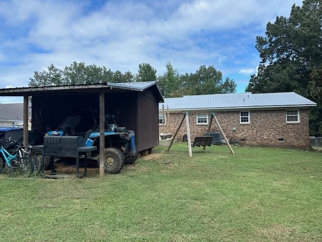 40 Lewter Road Crump, TN 38327 - Photo 21 of 25 Exterior space featuring a lawn
