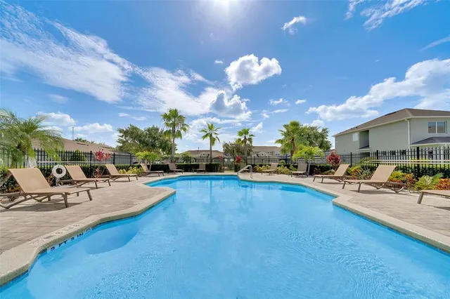 a view of outdoor space with playground and green space