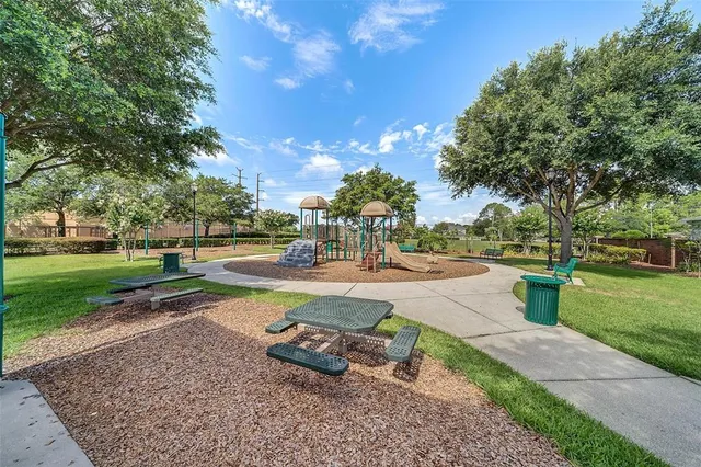 a view of a playground with basketball court
