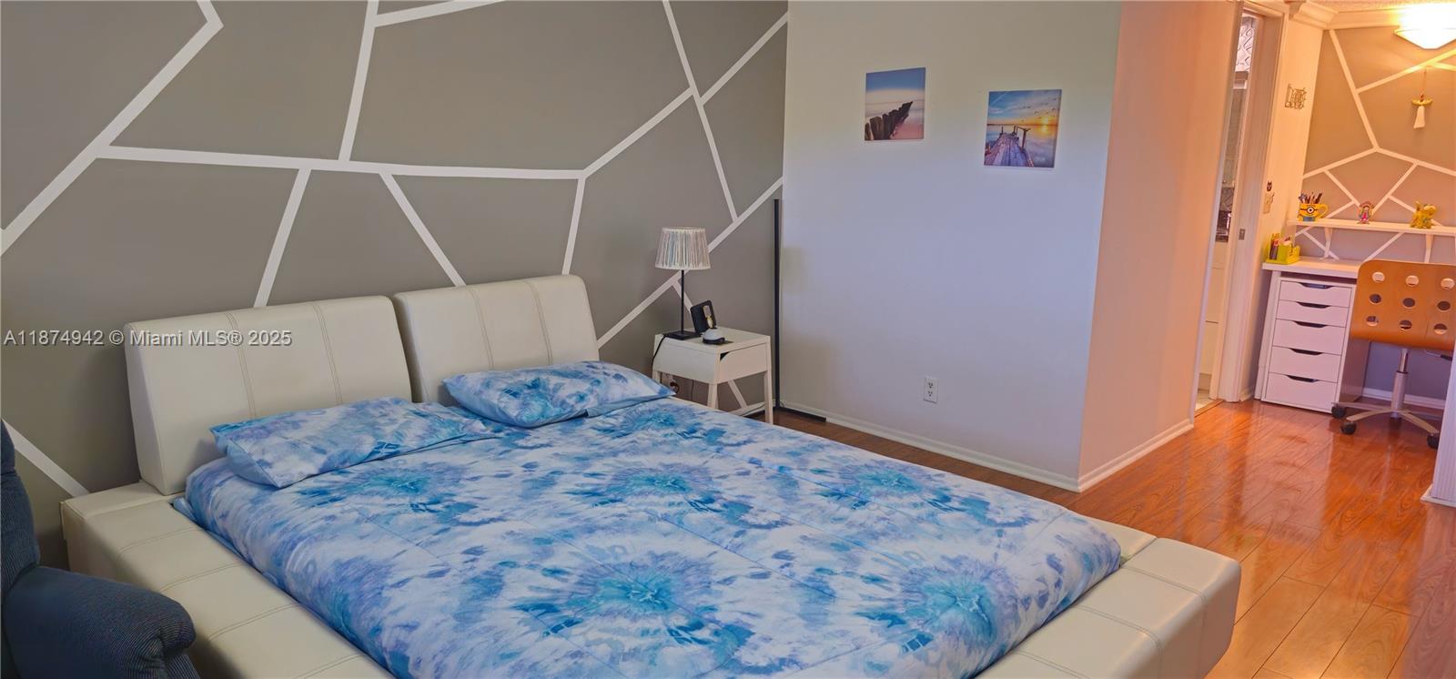 3100 North Course Lane, Unit 502 Pompano Beach, FL 33069 - Photo 22 of 32 a bedroom with a bed and a flat screen tv