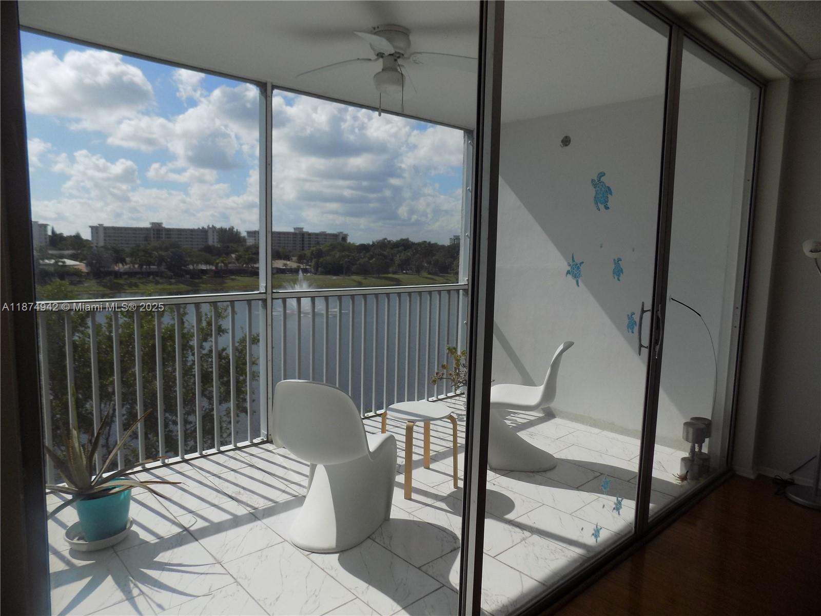 3100 North Course Lane, Unit 502 Pompano Beach, FL 33069 - Photo 23 of 32 a view of chair in the balcony
