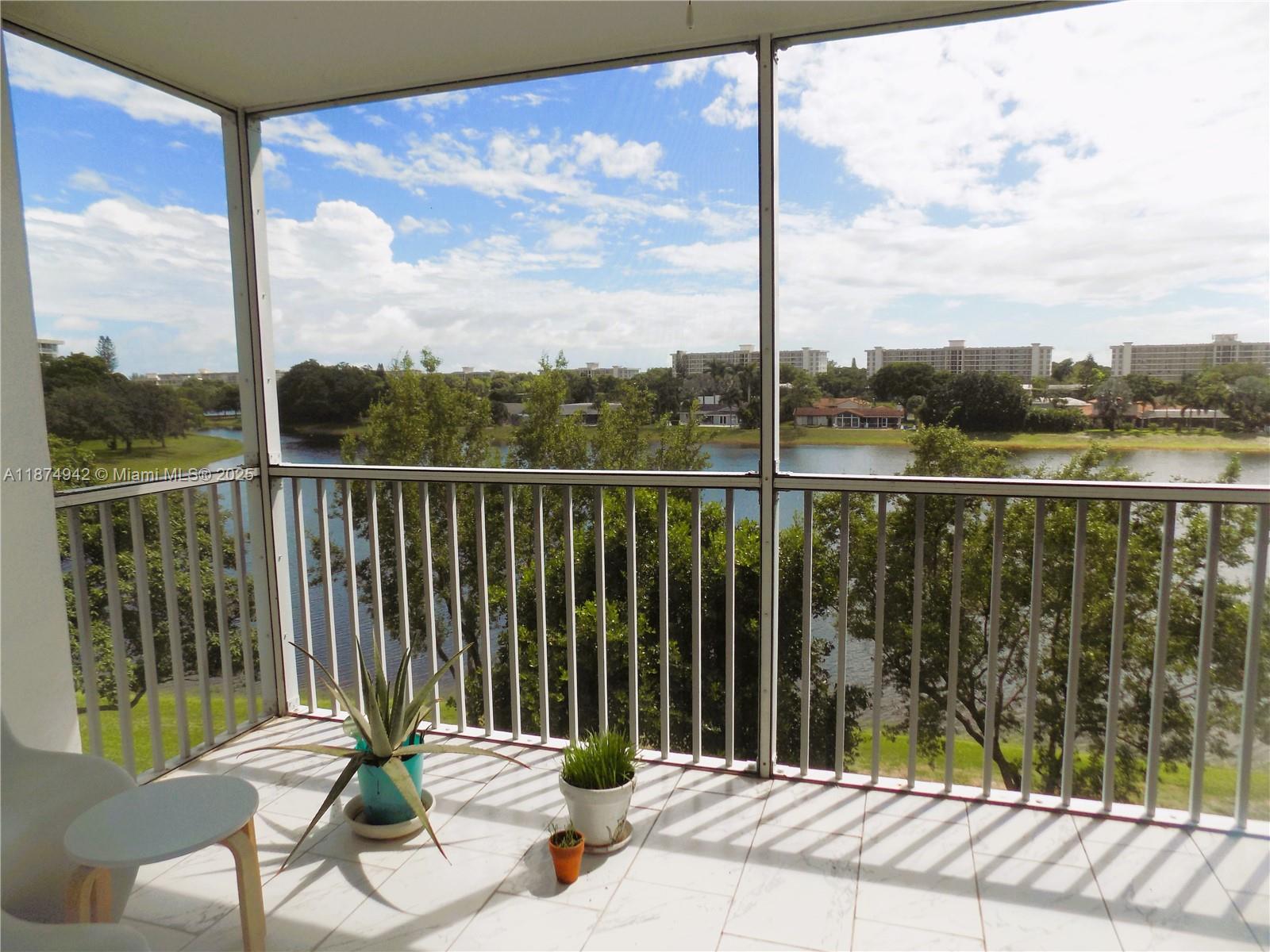 3100 North Course Lane, Unit 502 Pompano Beach, FL 33069 - Photo 24 of 32 a balcony view with a lake view