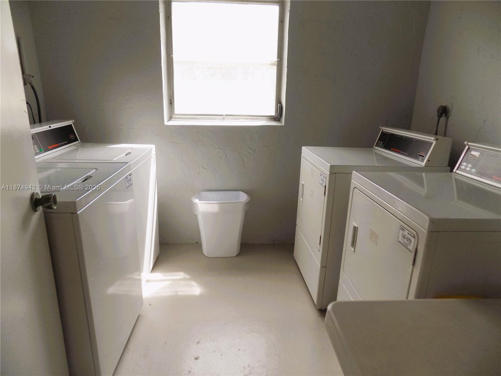 3100 North Course Lane, Unit 502 Pompano Beach, FL 33069 - Photo 29 of 32 a utility room with dryer and washer