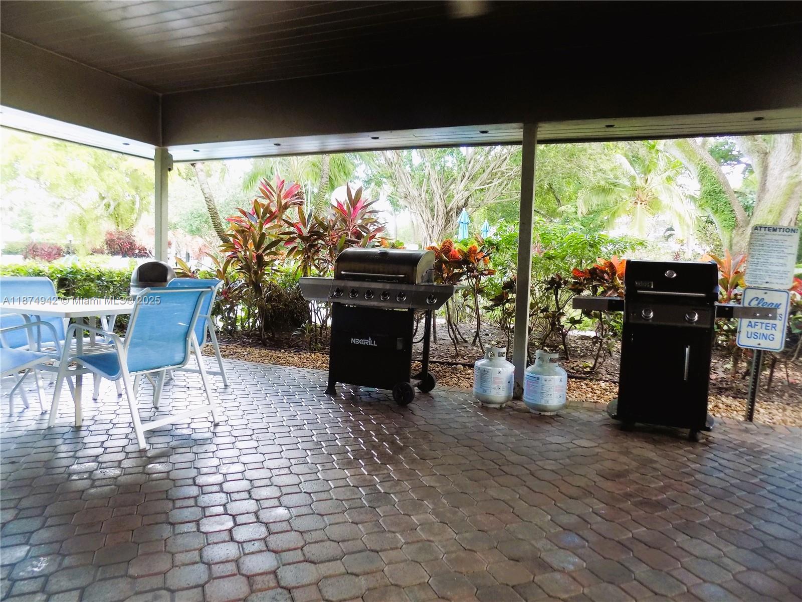 3100 North Course Lane, Unit 502 Pompano Beach, FL 33069 - Photo 32 of 32 a view of a dining room with furniture window and outside view
