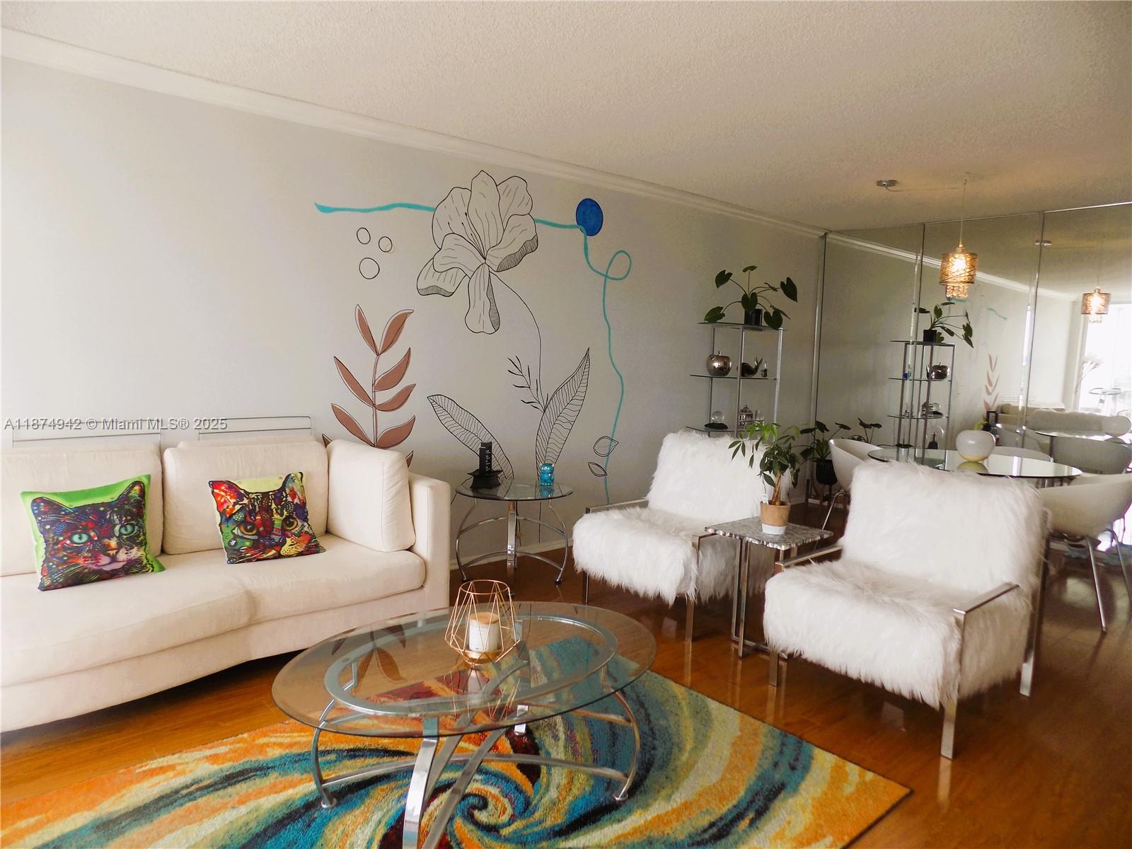 3100 North Course Lane, Unit 502 Pompano Beach, FL 33069 - Photo 4 of 32 a living room with furniture and wooden floor