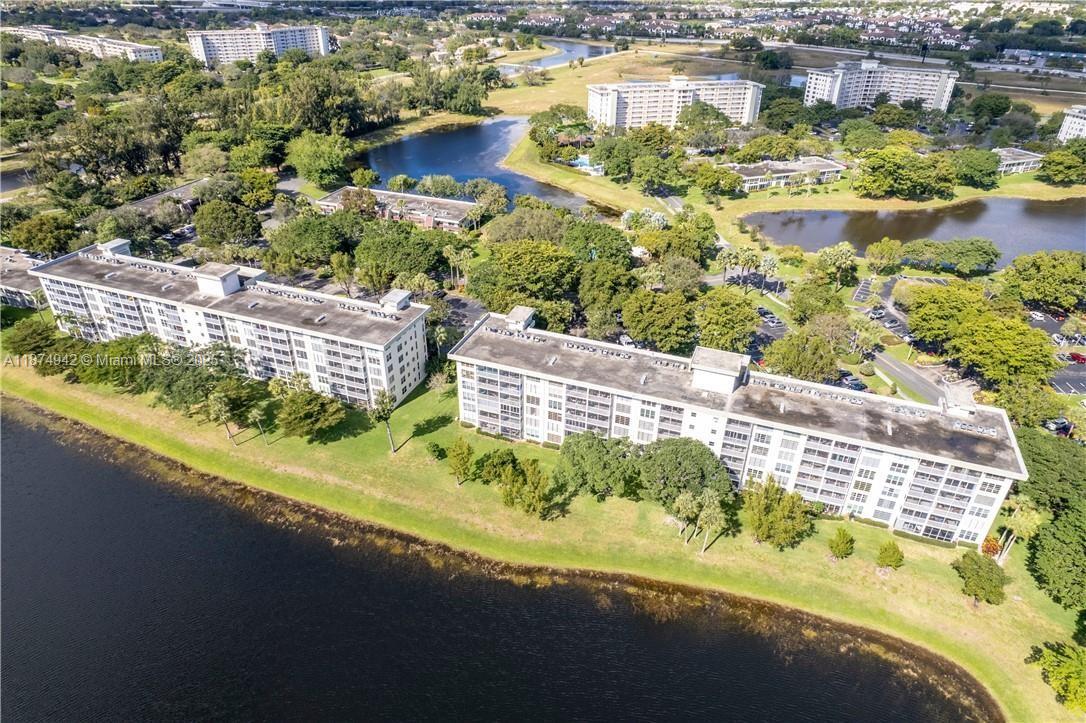 3100 North Course Lane, Unit 502 Pompano Beach, FL 33069 - Photo 7 of 32 a view of a swimming pool with a patio