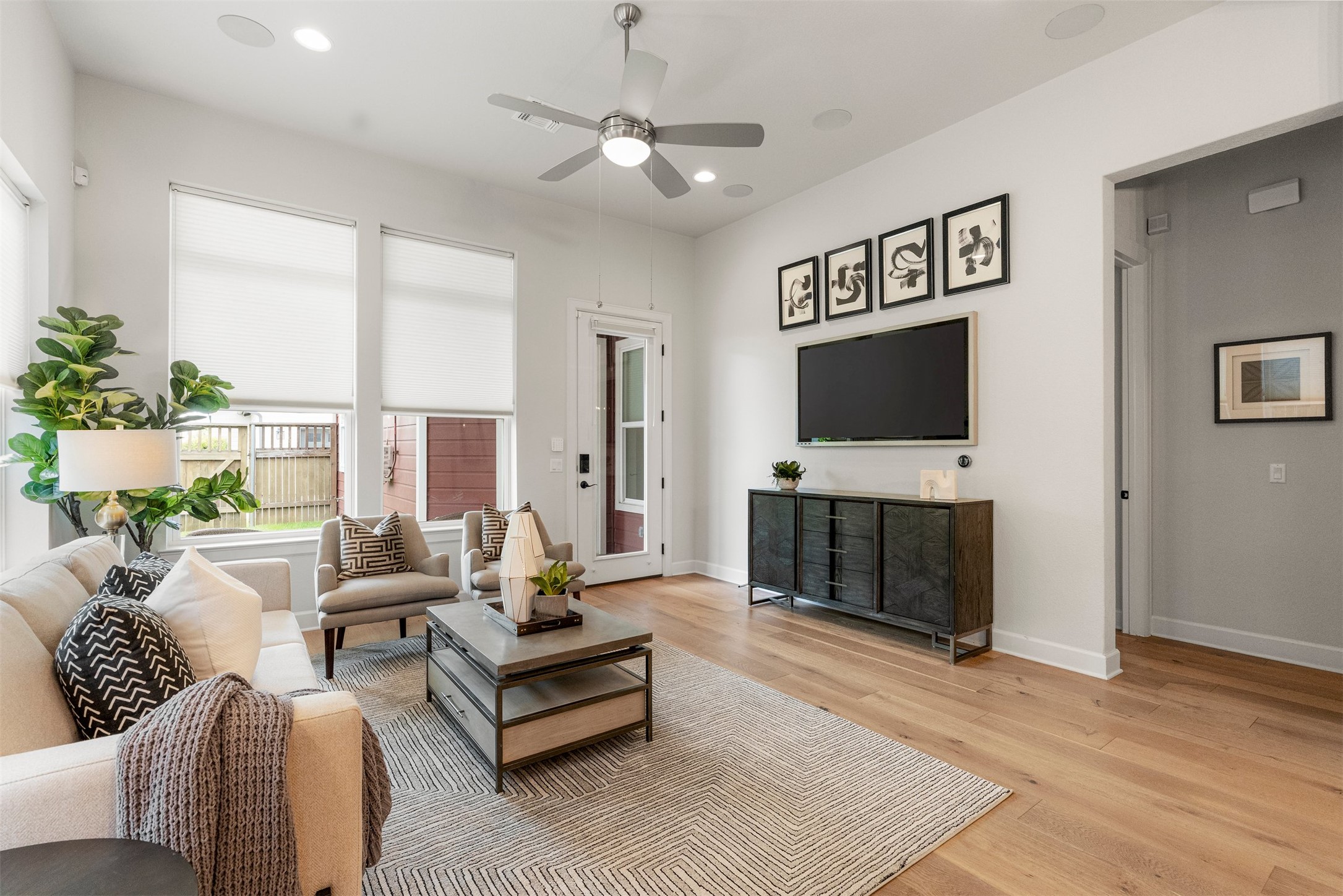 4313 Vaughan Street Austin, TX 78723 - Photo 18 of 39 The open layout gives you plenty of space for a deep sectional, creating a warm, flexible area where you can relax after a walk around Mueller or catch a movie on TV