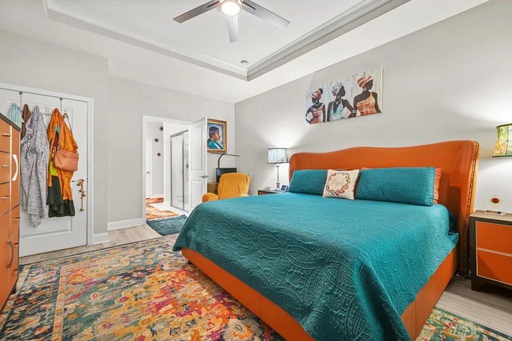 567 Barlow Place Grayson, GA 30017 - Photo 29 of 65 a bedroom with a bed and a painting on the wall