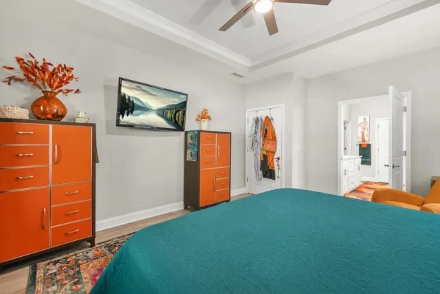 a view of walk in closet with clothes