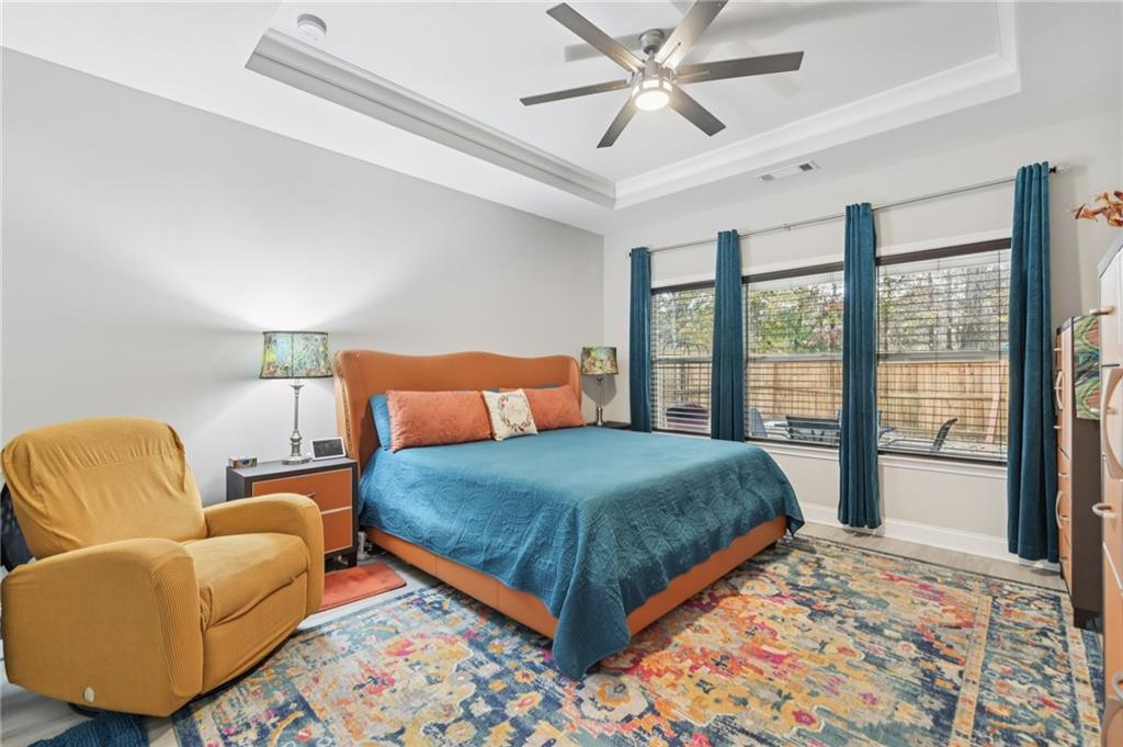 567 Barlow Place Grayson, GA 30017 - Photo 32 of 65 a bedroom with a bed and a couch