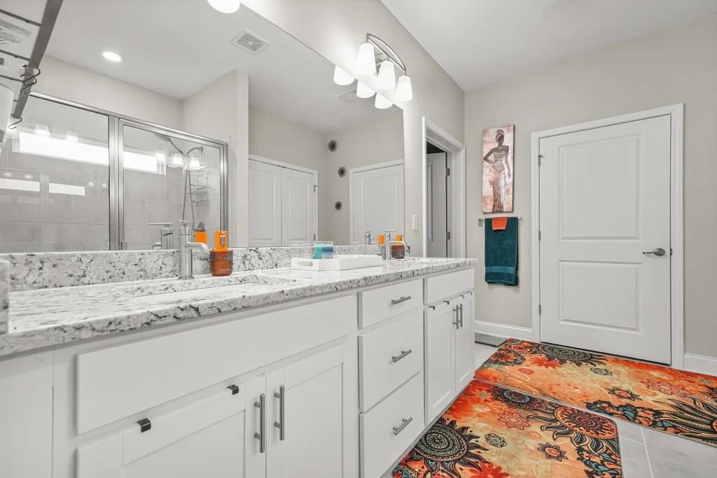 567 Barlow Place Grayson, GA 30017 - Photo 35 of 65 a spacious bathroom with a sink and a mirror