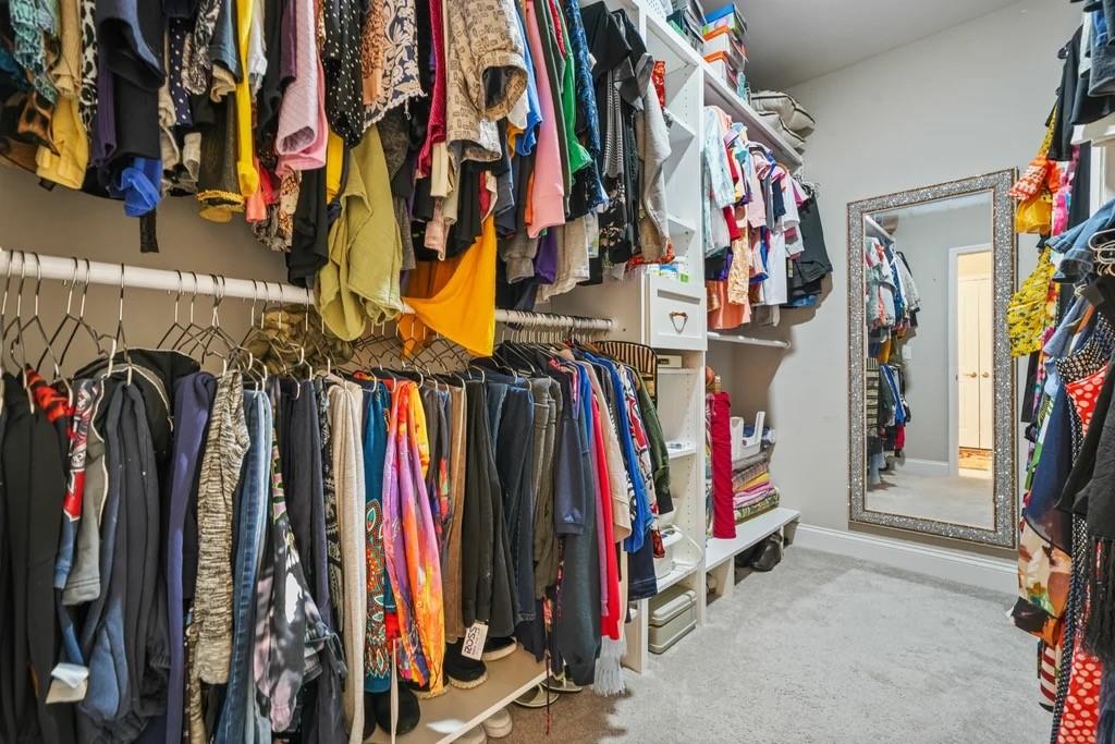 567 Barlow Place Grayson, GA 30017 - Photo 37 of 65 a view of walk in closet with clothes