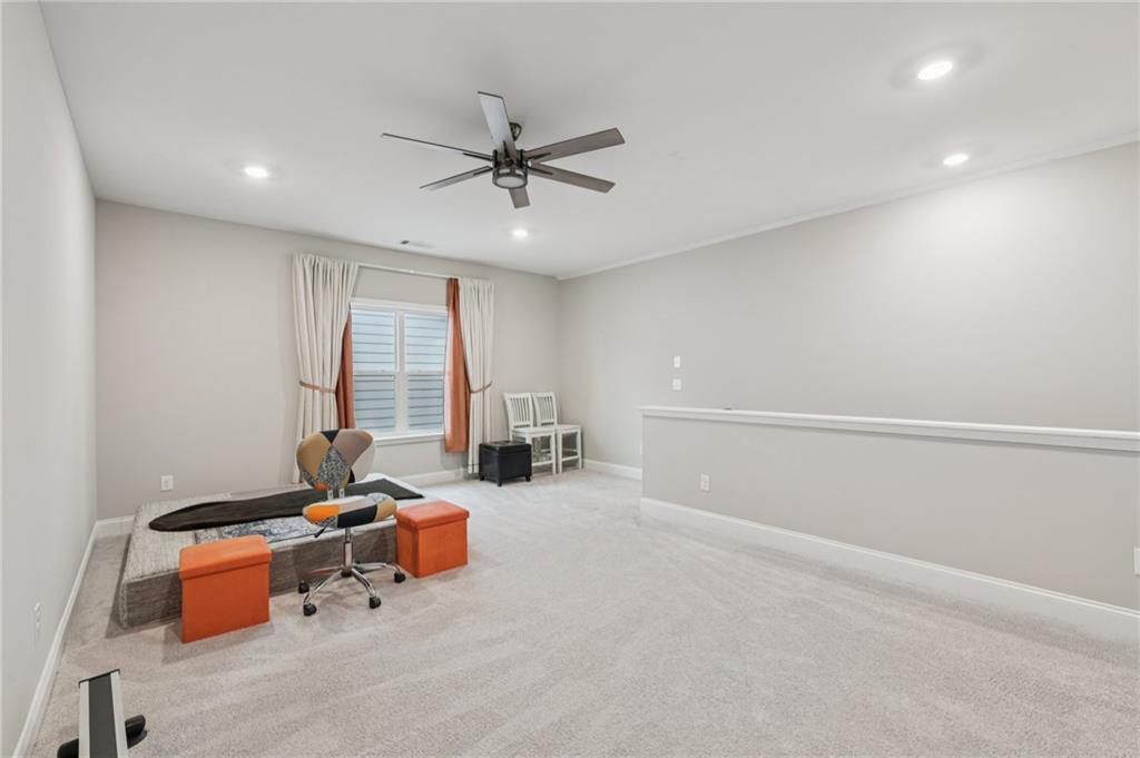 567 Barlow Place Grayson, GA 30017 - Photo 38 of 65 a living room with furniture and a window
