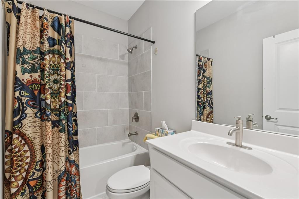 567 Barlow Place Grayson, GA 30017 - Photo 40 of 65 a bathroom with a sink toilet and shower