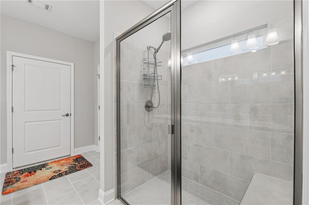 567 Barlow Place Grayson, GA 30017 - Photo 41 of 65 a bathroom with a shower and a sink