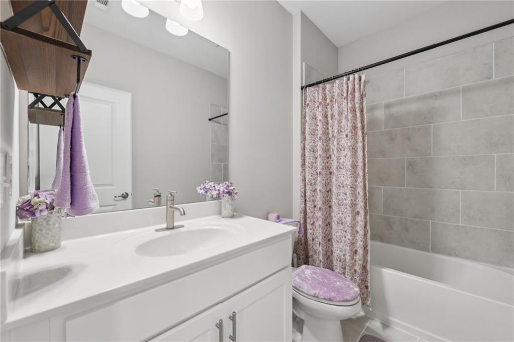 567 Barlow Place Grayson, GA 30017 - Photo 42 of 65 a bathroom with a sink toilet and shower