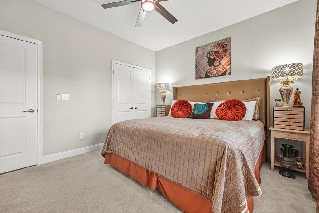 567 Barlow Place Grayson, GA 30017 - Photo 47 of 65 a bedroom with a bed and a painting on the wall