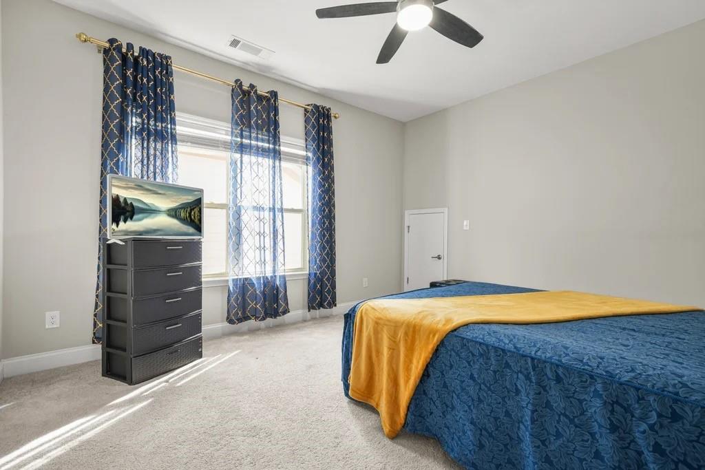 567 Barlow Place Grayson, GA 30017 - Photo 51 of 65 a bedroom with a bed and a window