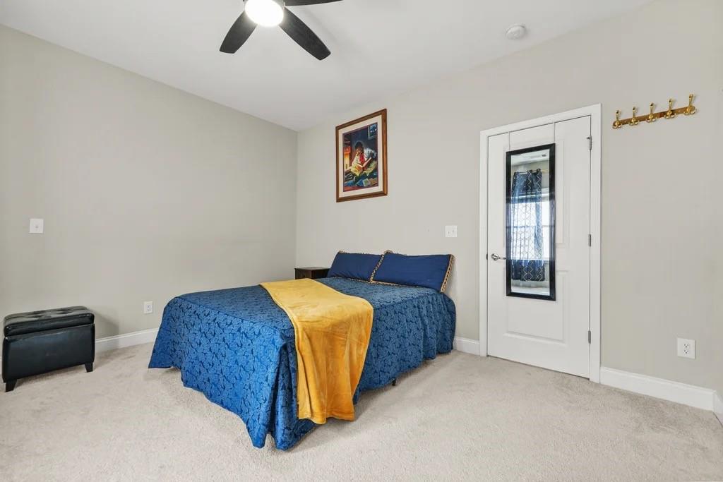 567 Barlow Place Grayson, GA 30017 - Photo 52 of 65 a bedroom with bed and window