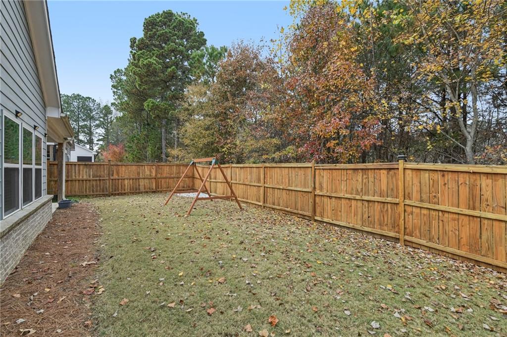 567 Barlow Place Grayson, GA 30017 - Photo 7 of 65 a view of a backyard