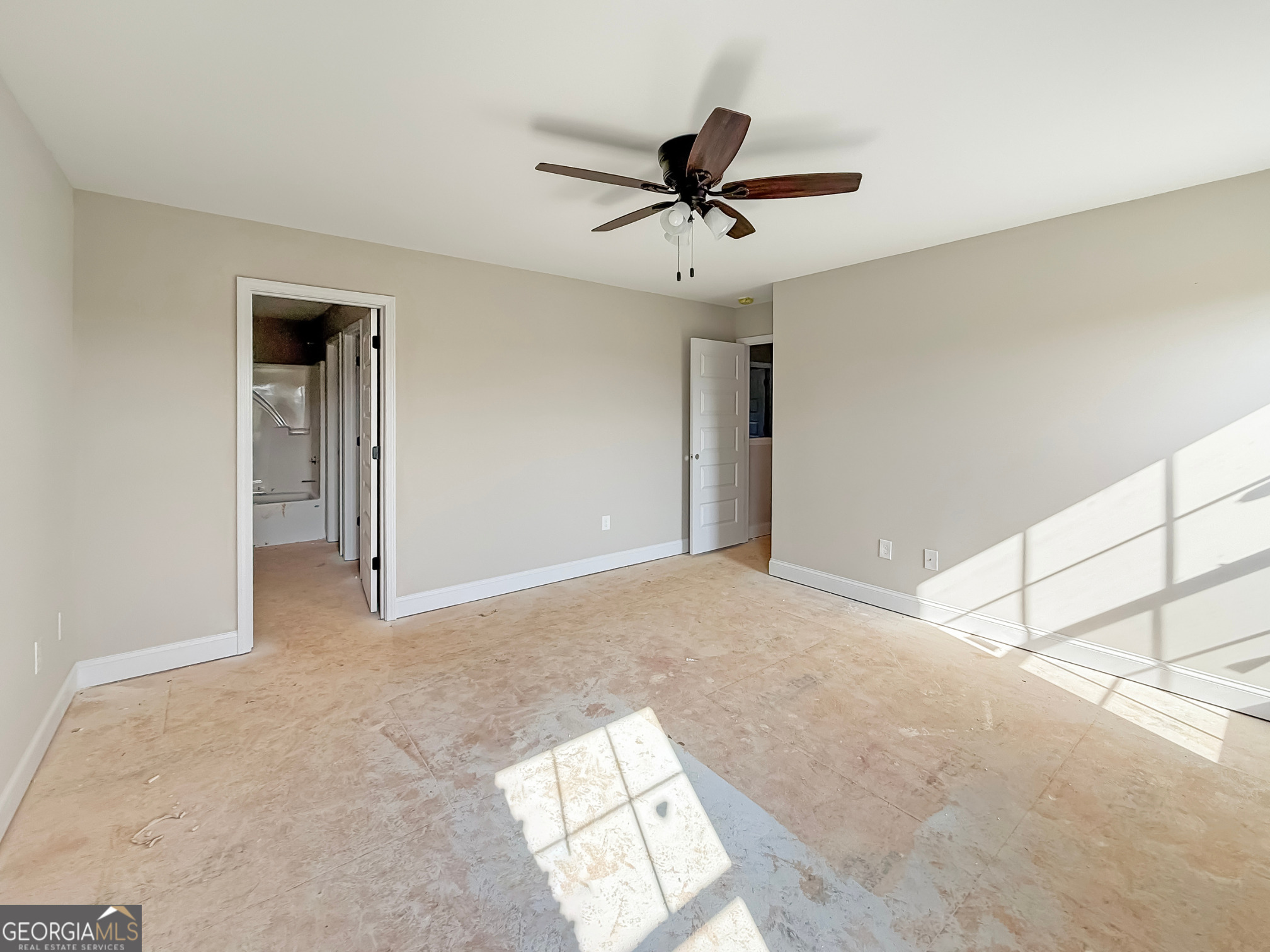 206 Sutton Drive Perry, GA 31069 - Photo 21 of 27 a view of a livingroom with a ceiling fan and window