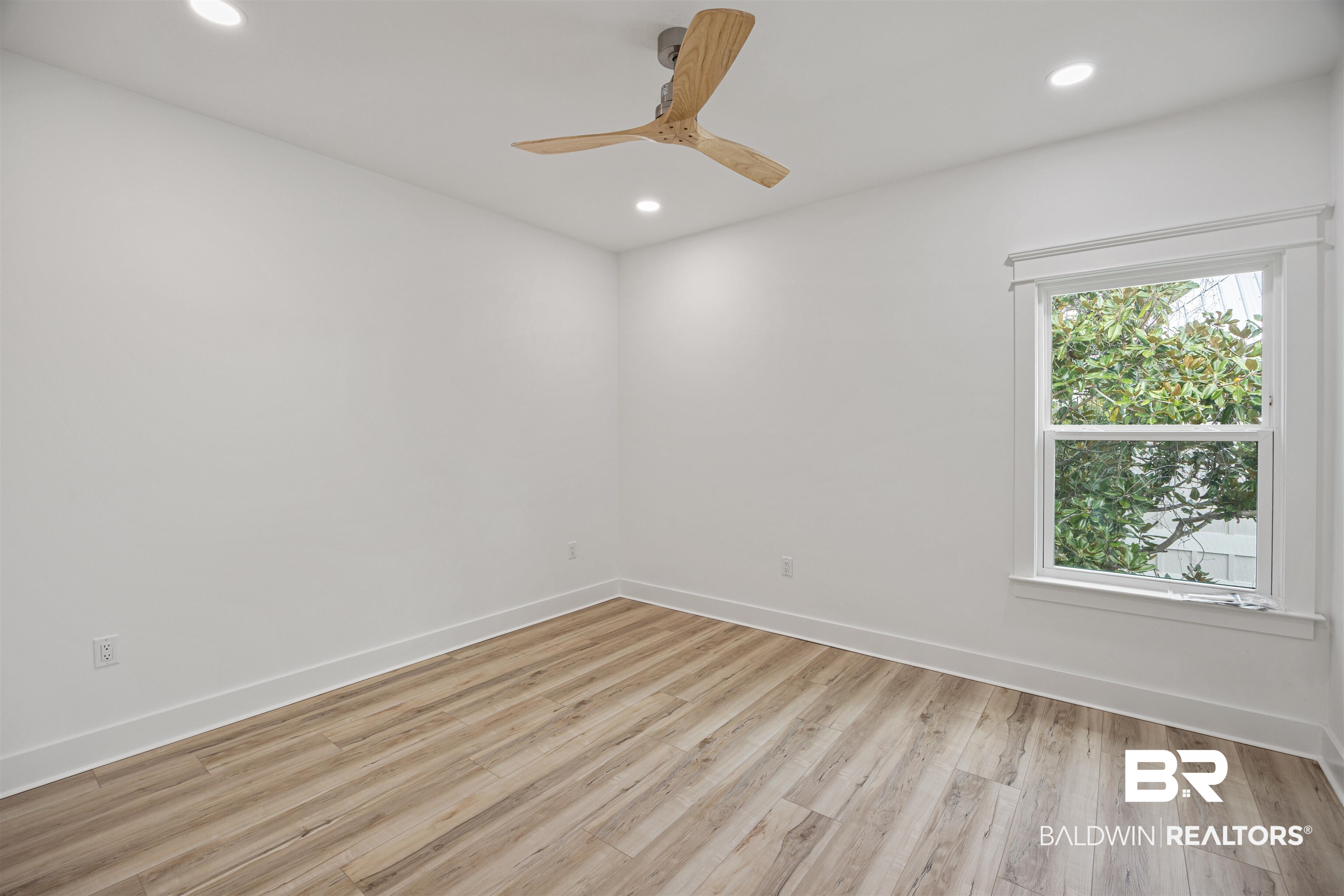 27591 Canal Road Orange Beach, AL 36561 - Photo 33 of 51 Unfurnished room featuring light wood finished floors, recessed lighting, and ceiling fan