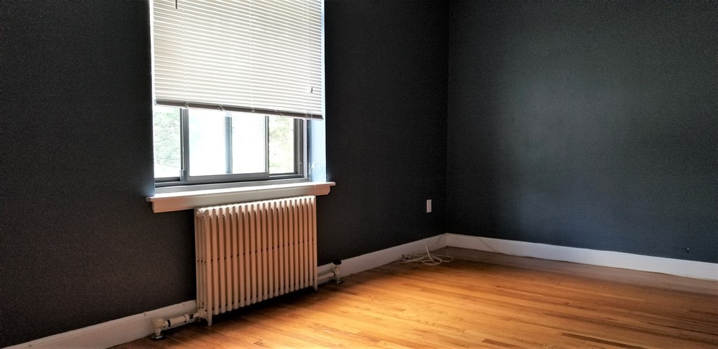 14 Ashland Street, Unit 2R Worcester, MA 01609 - Photo 11 of 16 a view of empty room with wooden floor