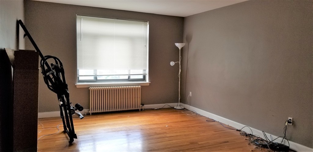 14 Ashland Street, Unit 2R Worcester, MA 01609 - Photo 2 of 16 wooden floor and window in a room