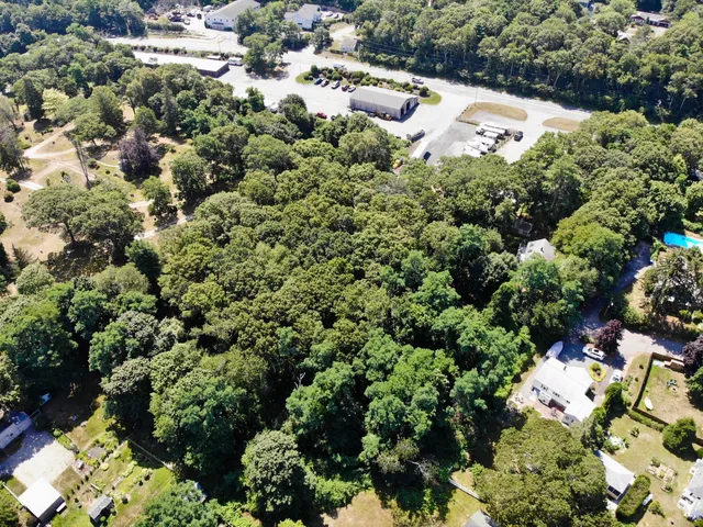 a view of a garden with a house