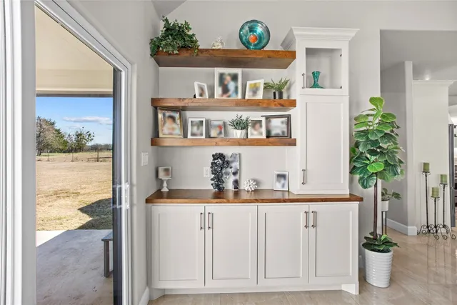 a kitchen view with table and chairs
