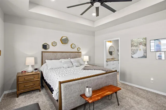 a bedroom with a bed and a table in it