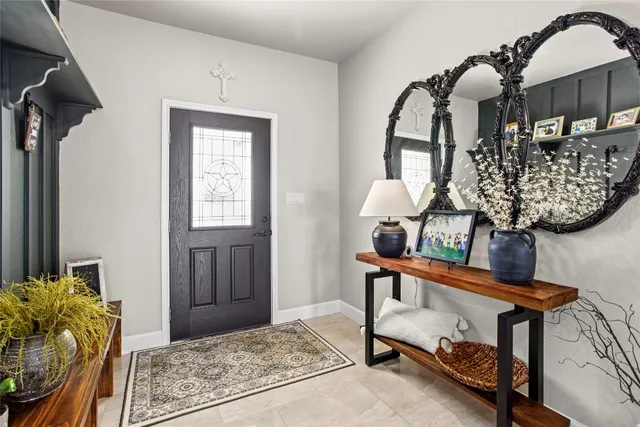 a bedroom with furniture and a window