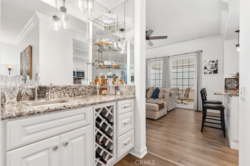 19451 Pompano Lane, Unit 110 Huntington Beach, CA 92648 - Photo 12 of 54 a spacious bathroom with a granite countertop sink mirror and a bath tub