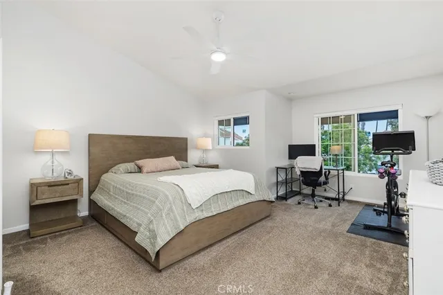 a bedroom with a bed and a dresser in it