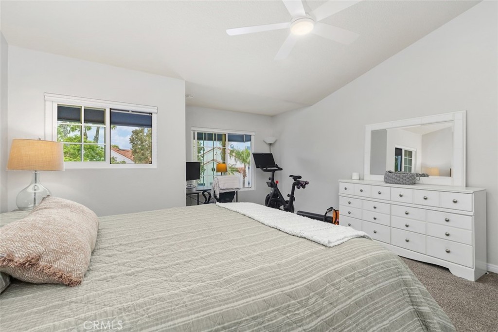 19451 Pompano Lane, Unit 110 Huntington Beach, CA 92648 - Photo 22 of 54 a bedroom with a bed and a dresser in it