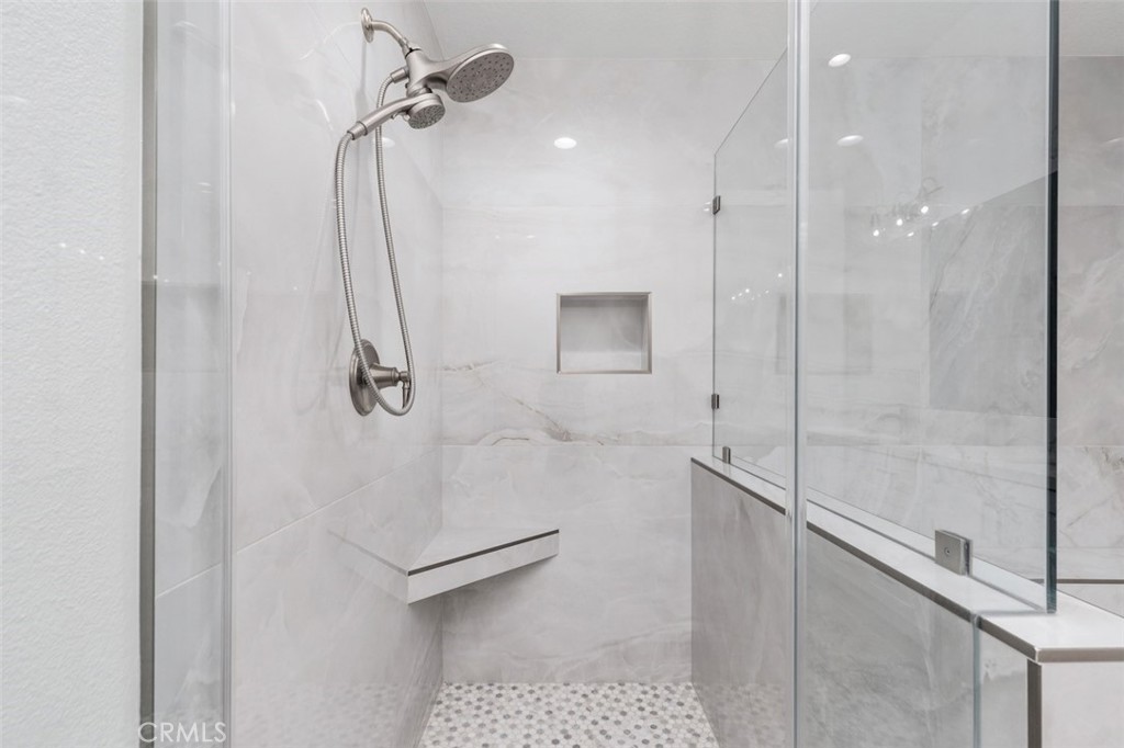 19451 Pompano Lane, Unit 110 Huntington Beach, CA 92648 - Photo 27 of 54 a bathroom with a shower