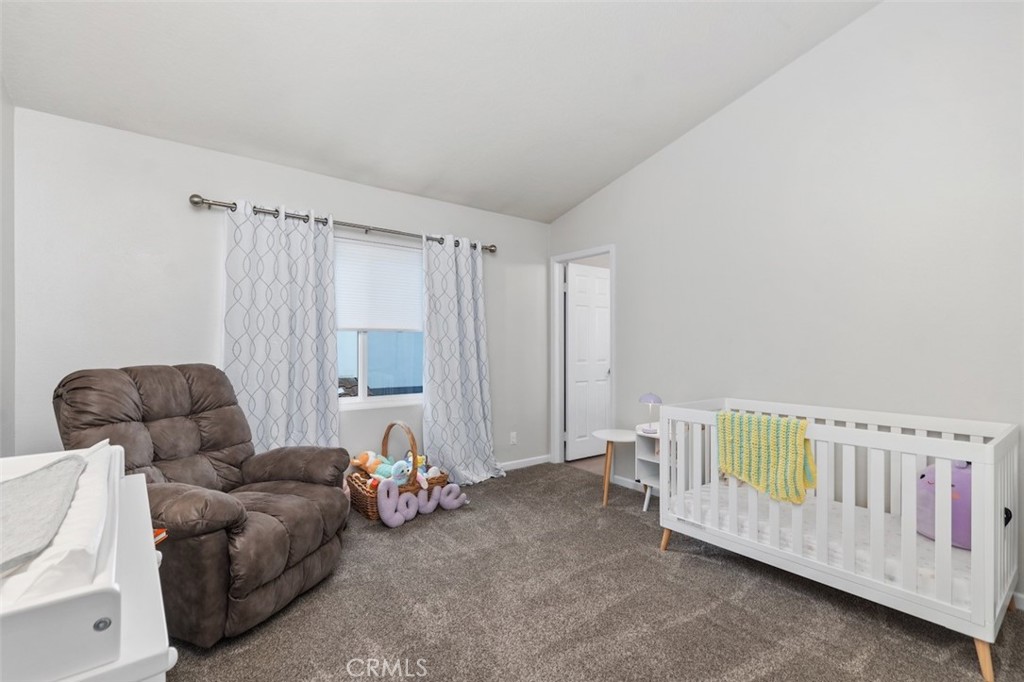 19451 Pompano Lane, Unit 110 Huntington Beach, CA 92648 - Photo 32 of 54 a bedroom with furniture and a bed