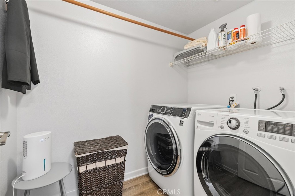 19451 Pompano Lane, Unit 110 Huntington Beach, CA 92648 - Photo 36 of 54 a view of washer and dryer in a utility room